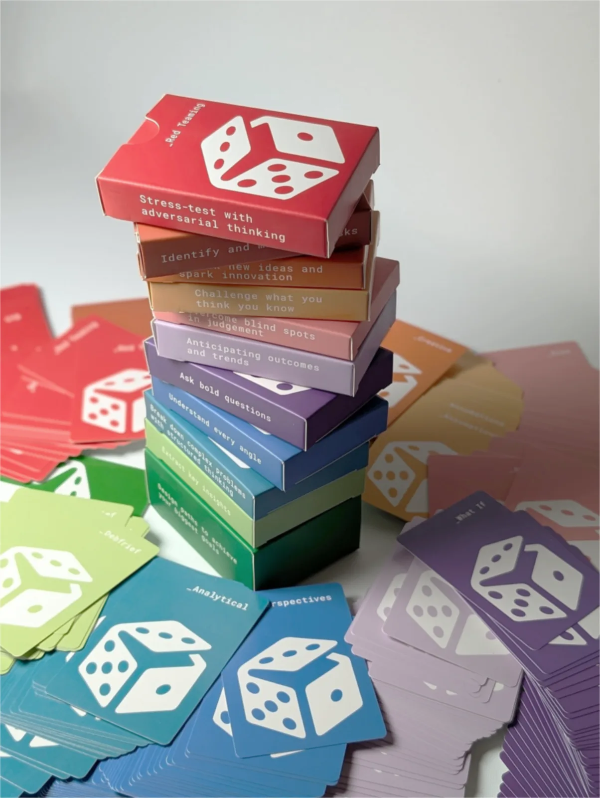 11 PRISM decks stacked showing the rainbow color spectrum